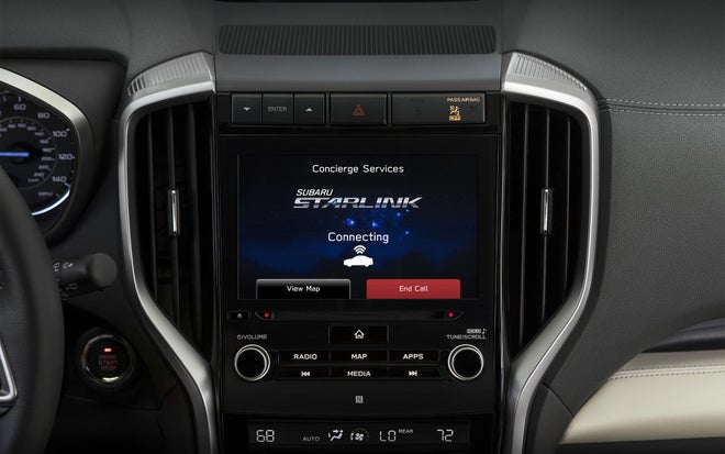 In-vehicle touchscreen displaying showing it is connecting with a STARLINK Concierge