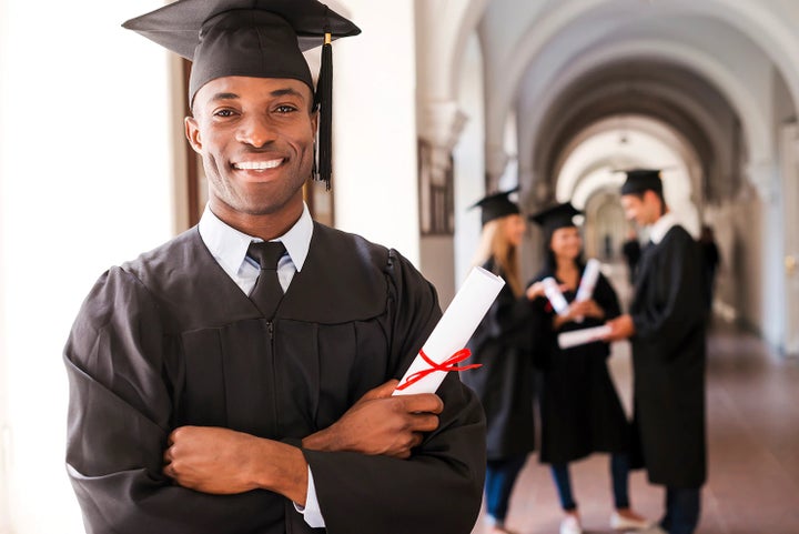 college graduate holding his diploma | Bergstrom Subaru Oshkosh in Oshkosh WI