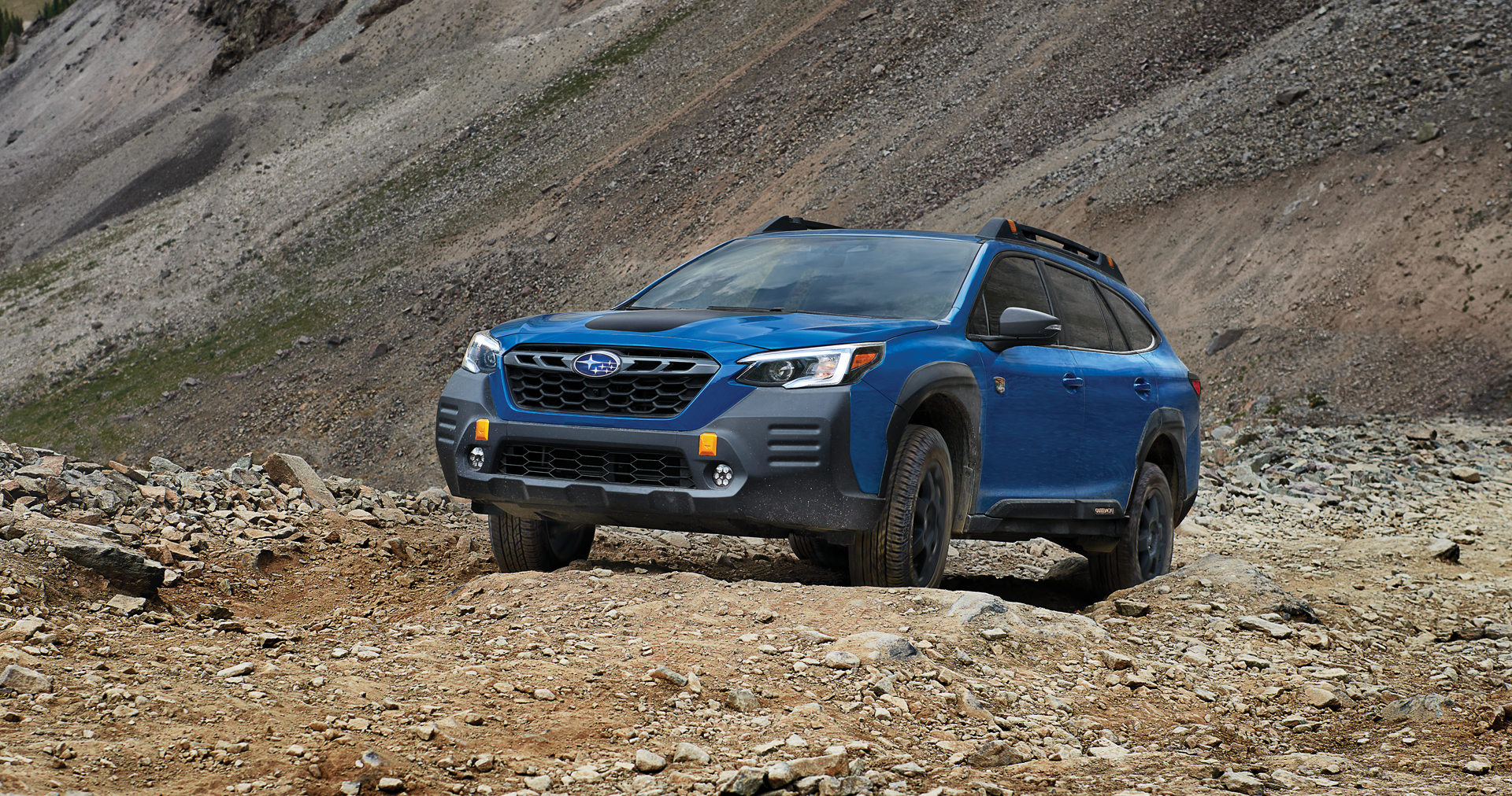 A 2023 Outback Wilderness driving on a trail in the mountains. | Bergstrom Subaru Oshkosh in Oshkosh WI