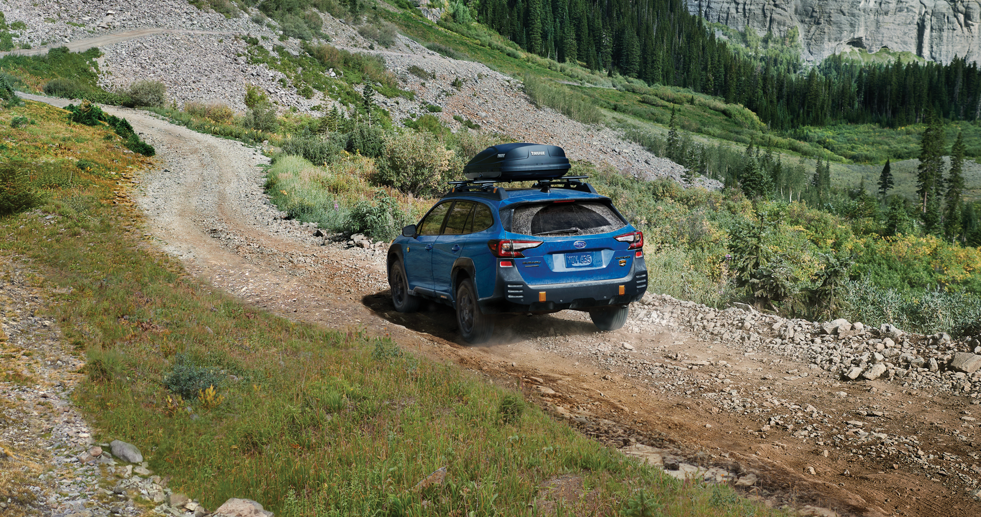 A 2023 Outback Wilderness driving on a trail in the mountains. | Bergstrom Subaru Oshkosh in Oshkosh WI